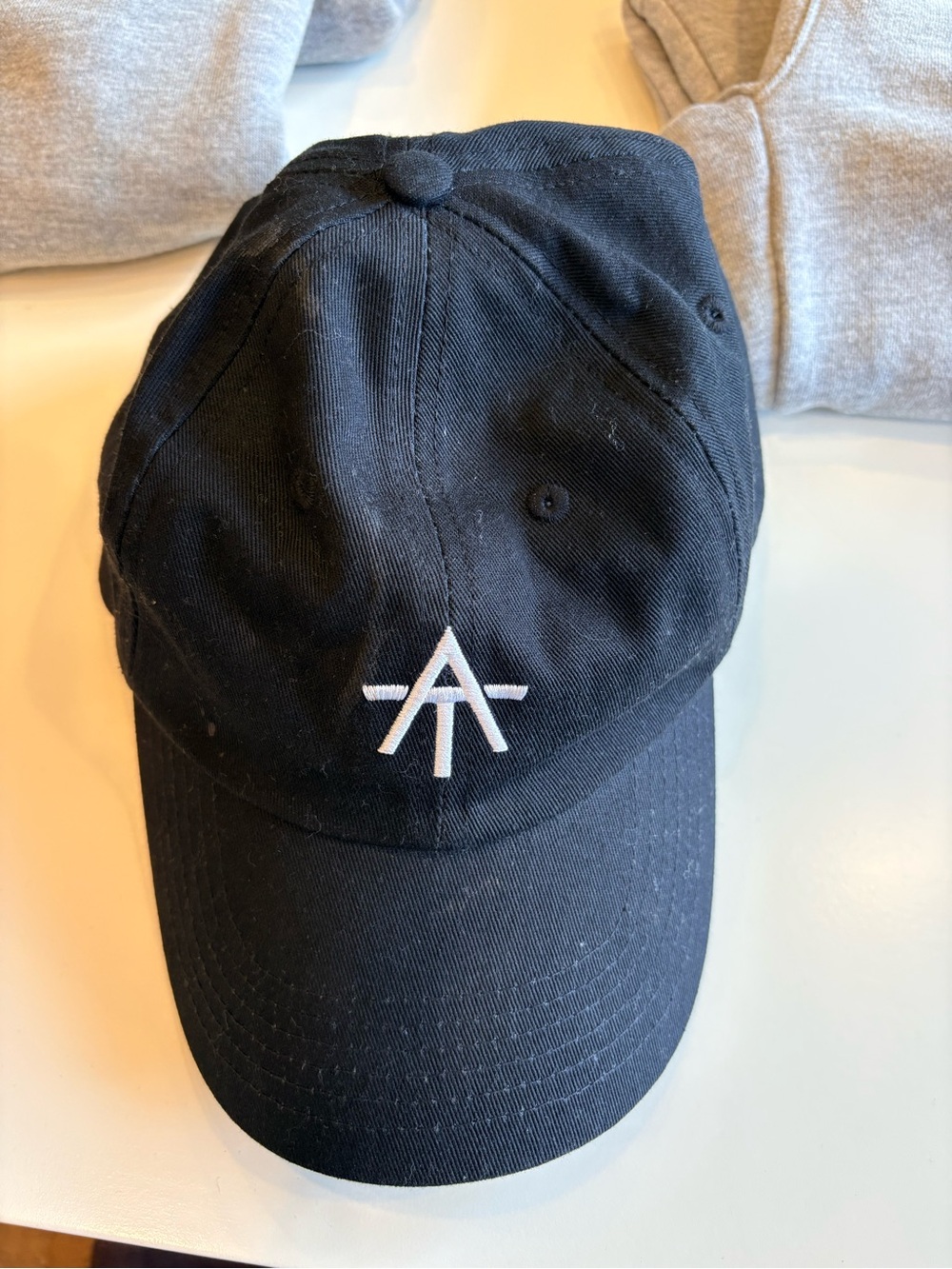 Alex Toussaint “DO BETTER” Peloton Black Cap  - Men's Accessory